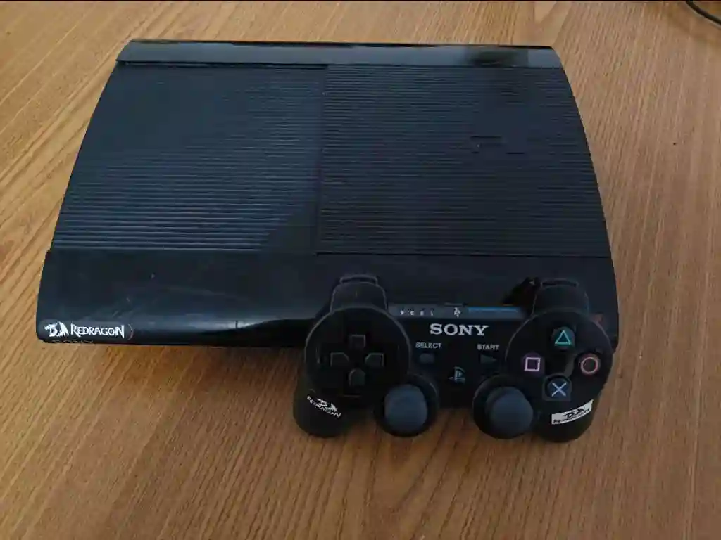 PS3 Slim Avec une Manette Originale - Vue 1